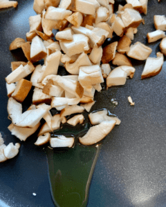 shiitake mushrooms for Asian-Inspired Vegan Ceviche, made with heart of palm, shiitake mushrooms, edamame, red peppers, red onion, cilantro, chives, hemp hearts, and a lime Asian-inspired marinade.