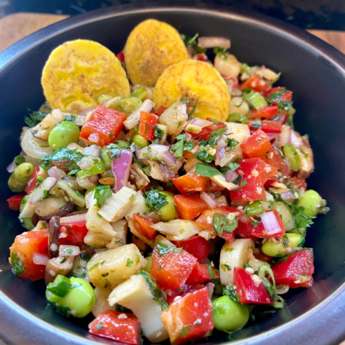 Asian-inspired ceviche made with heart of palm, shiitake mushrooms, edamame, peppers, onions, green onions, ginger, 5 spice