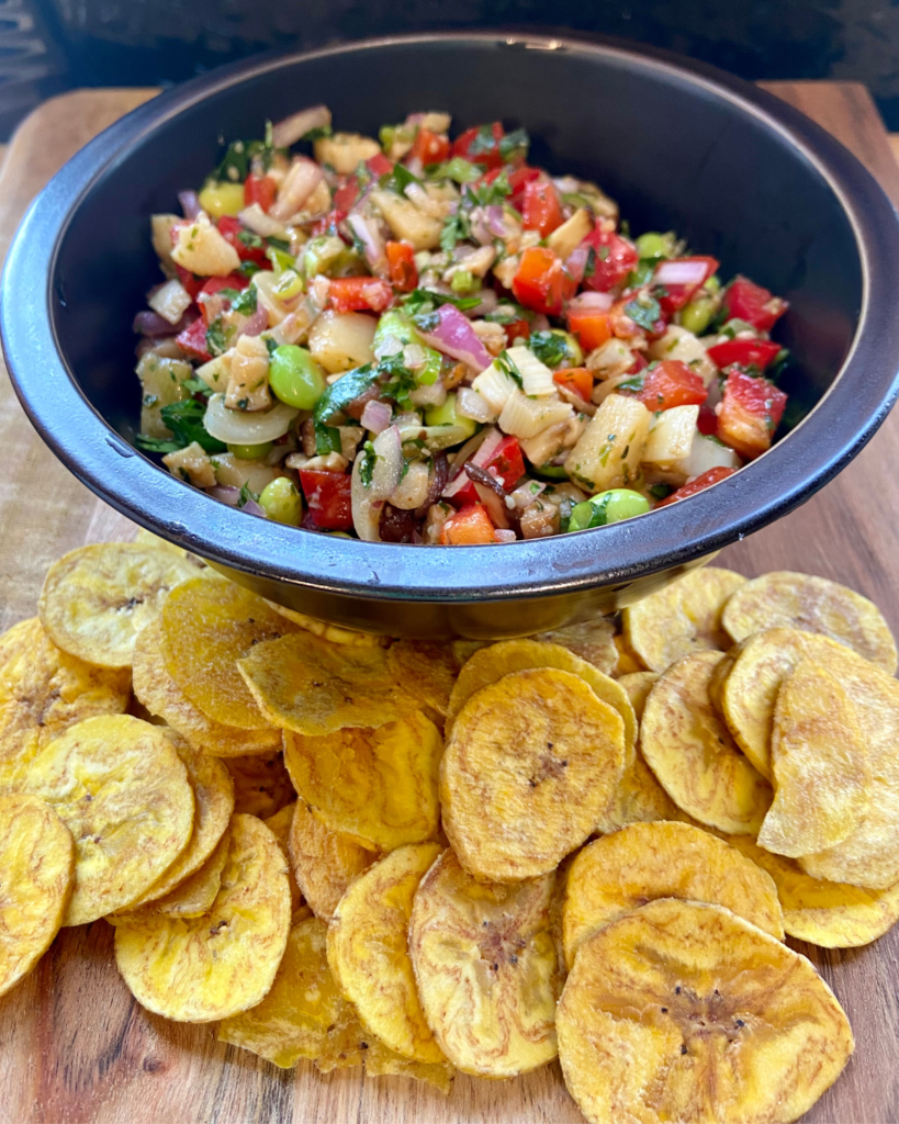 Asian-Inspired Vegan Ceviche, made with heart of palm, shiitake mushrooms, edamame, red peppers, red onion, cilantro, chives, hemp hearts, and a lime Asian-inspired marinade.