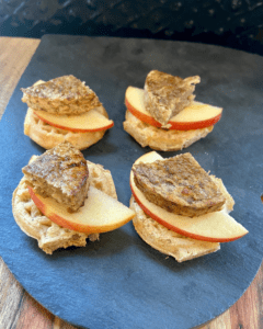 Vegan Waffle Sliders with Rosemary Maple. Vegan breakfast sausage and sliced apple, sandwiched between mini waffles and dipped in rosemary maple syrup.