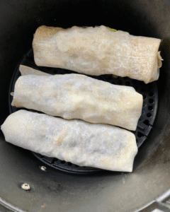 Vegan Bulgogi Egg Rolls, loaded with plant-based Bulgogi "beef", rice, kimchi, and cabbage. Air-fried to perfection!