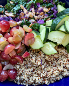 cucumber and grapes for Tofu and almond quinoa salad made with grapes, kale, cabbage, carrots, cucumbers, and a savory Asian dressing. 