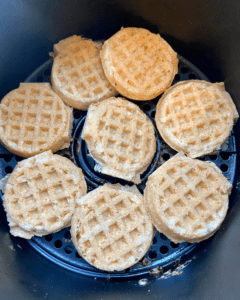 mini waffles for Vegan Waffle Sliders with Rosemary Maple. Vegan breakfast sausage and sliced apple, sandwiched between mini waffles and dipped in rosemary maple syrup.