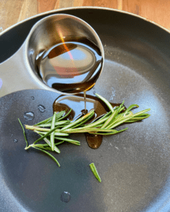 rosemary maple syrup for Vegan Waffle Sliders with Rosemary Maple. Vegan breakfast sausage and sliced apple, sandwiched between mini waffles and dipped in rosemary maple syrup. Perfect combination of sweet and savory!