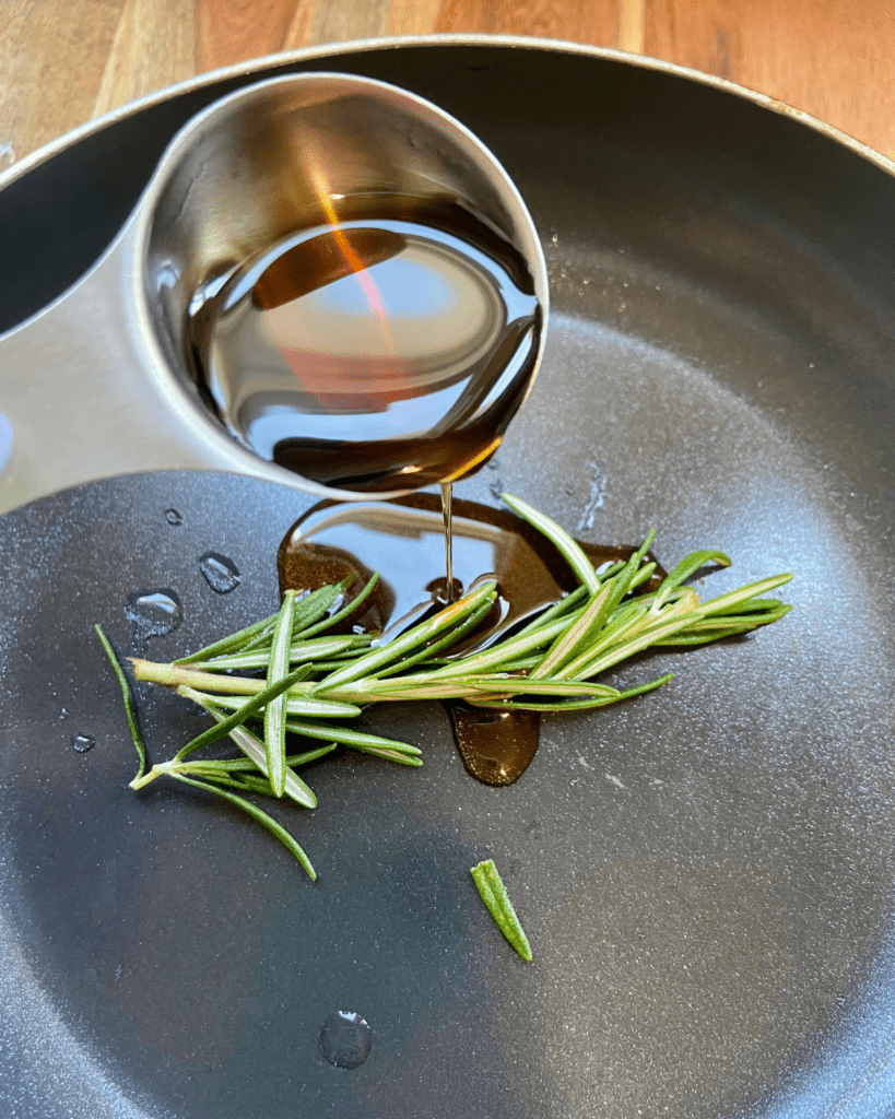 rosemary maple syrup for Vegan Waffle Sliders with Rosemary Maple.  Vegan breakfast sausage and sliced apple, sandwiched between mini waffles and dipped in rosemary maple syrup. 