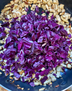 cabbage for Tofu and almond quinoa salad made with grapes, kale, cabbage, carrots, cucumbers, and a savory Asian dressing. 