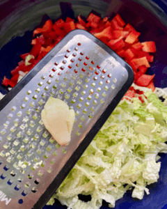 slaw for Vegan taco stuffed with spicy five spice tofu crumble, Asian red pepper slaw, fresh sliced avocado, green onion.