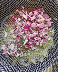 onions for slaw for Vegan taco stuffed with spicy five spice tofu crumble, Asian red pepper slaw, fresh sliced avocado, green onion.