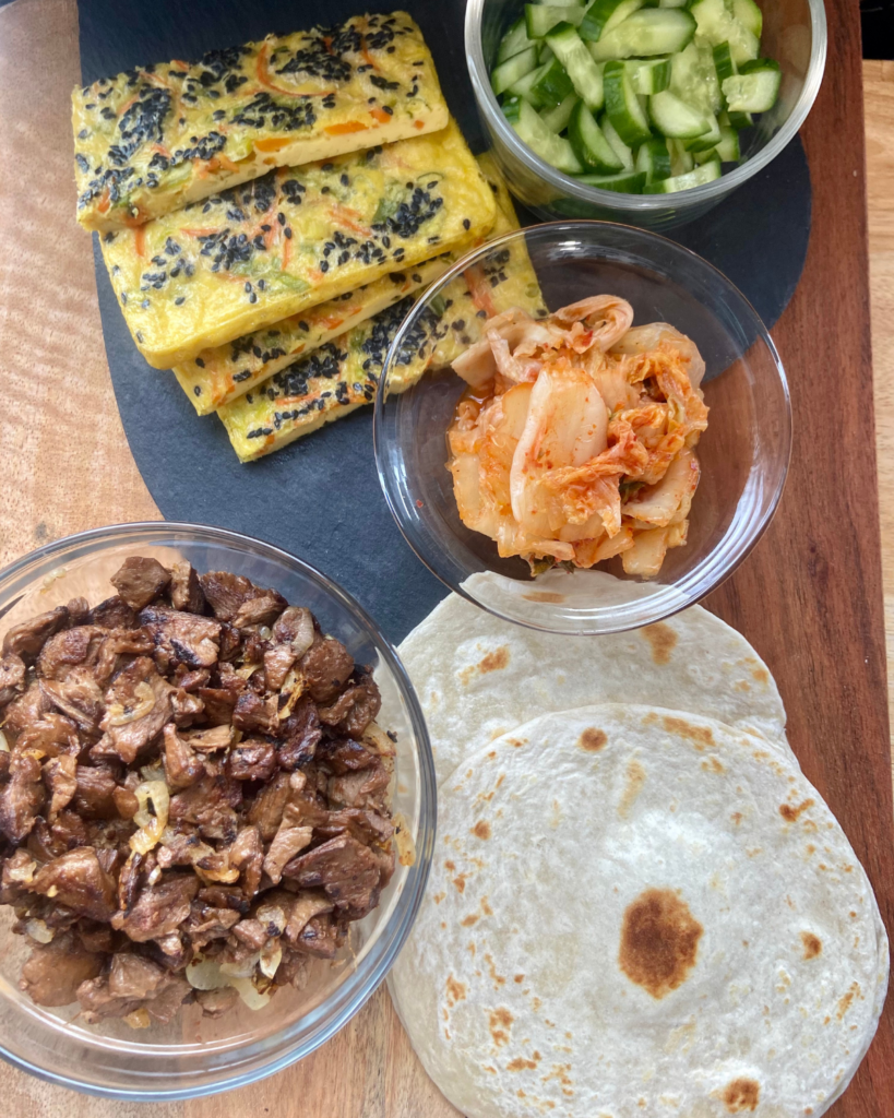 vegan egg, Asian vegan steak, tortillas, kimchi, cucumbers for healthy vegan breakfast recipe