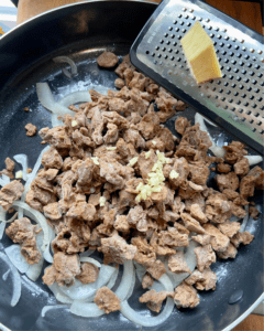 adding garlic and ginger to vegan steak