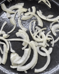 onions and olive oil in pan