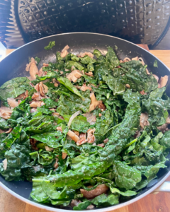 shiitake mushrooms and kale in miso butter sauce with pecans and shallots