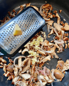 adding garlic and ginger to pan