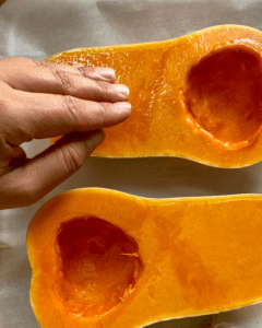 spreading oil on butternut squash