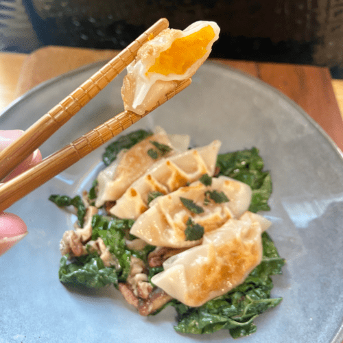 vegan butternut squash dumplings served with Shiitake mushroom and kale in a miso butter with pecans and shallots. Asian fusion recipe