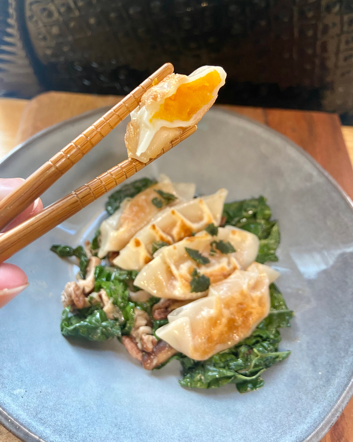 vegan butternut squash dumplings served with Shiitake mushroom and kale in a miso butter with pecans and shallots. Asian fusion recipe