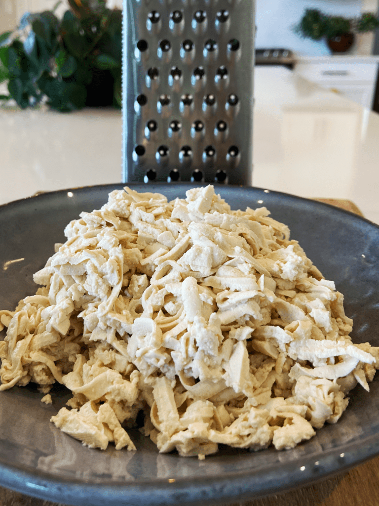 shredding tofu with cheese grater