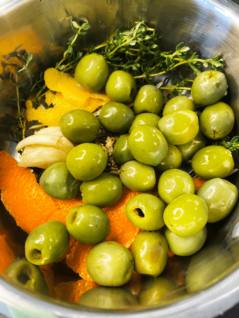 ingredients for warm marinated olives for charcuterie board