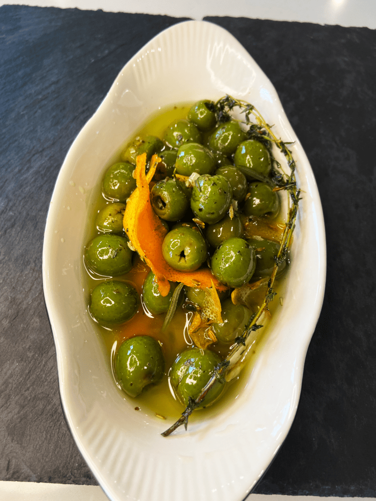 warm marinated olives for charcuterie board