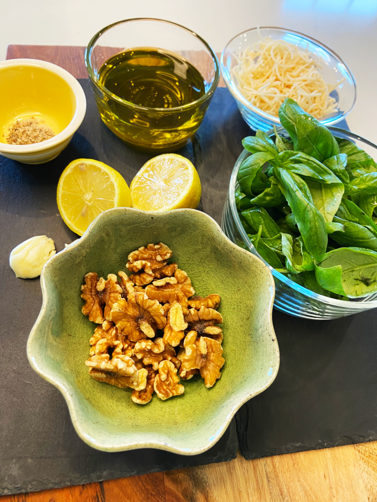 ingredients for vegan pesto recipe with walnuts