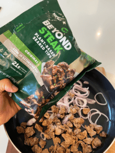 shallots and beyond vegan steak tips in pan