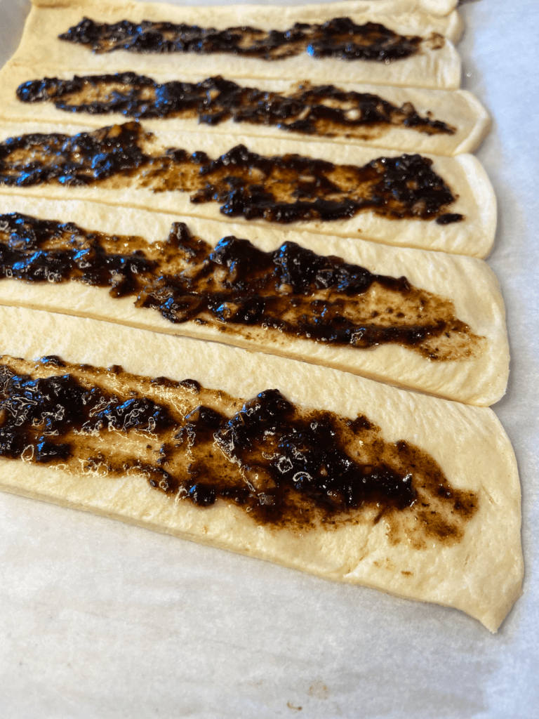 pillsbury dough with balsamic black garlic spread on top