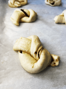 black garlic pillsbury knots on baking sheet