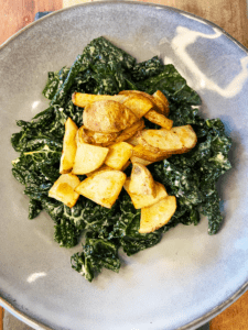 plating potatoes for vegan steak and kale salad