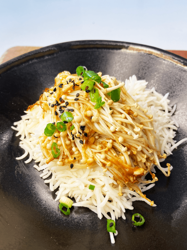 air fried enoki mushrooms with miso sake sauce over rice