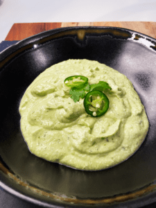 vegan jalapeno avocado crema in serving bowl