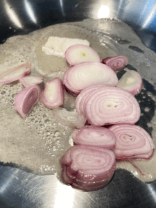 shallot and vegan butter in skillet for vegan Guinness Gravy