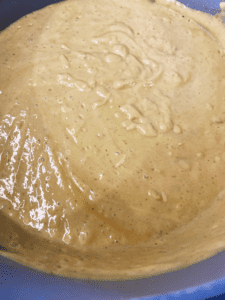 Guinness vegan cheese sauce cooking in a pan