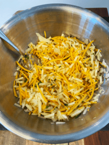 mixed ingredients for vegan cheese potato hash