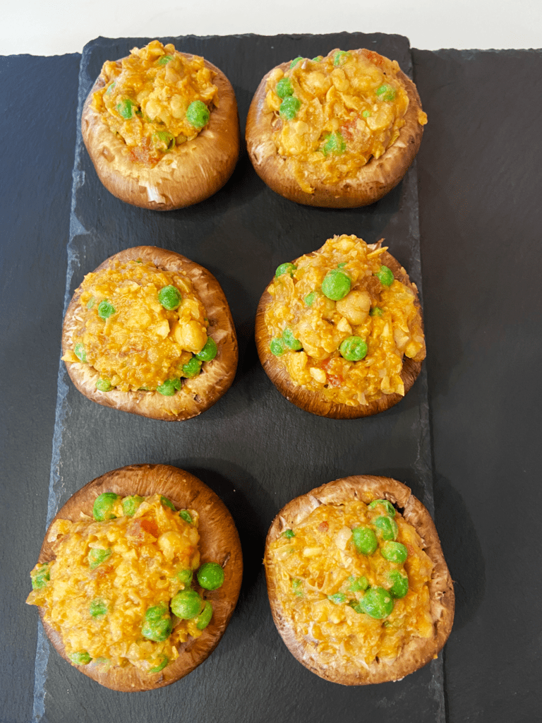 stuffing mushrooms with curry chickpeas mix