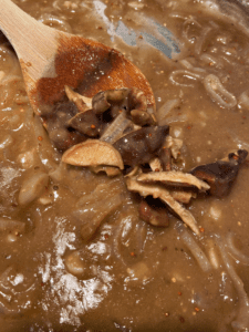 sliced mushrooms in vegan Guinness gravy