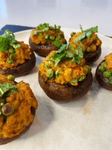 adding mint and cilantro to curry chickpea stuffed air fryer Indian mushrooms recipe