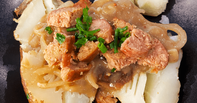 vegan bangers and mash baked potatoes with Guinness gravy