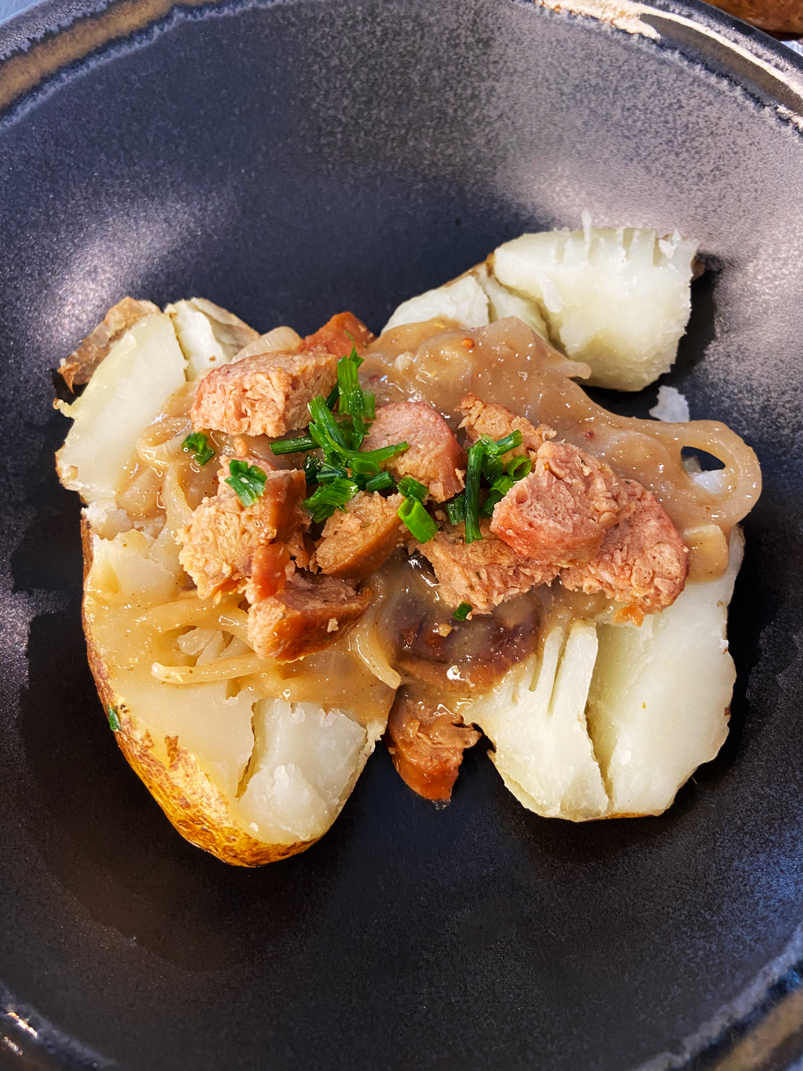 vegan bangers and mash baked potatoes with Guinness gravy