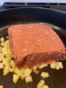 adding vegan beyond beef to skillet