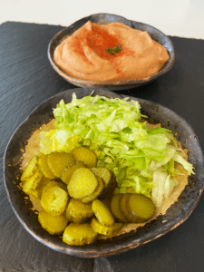 sliced pickle and shredded lettuce