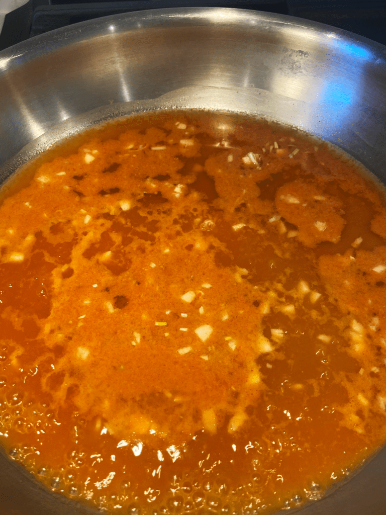 Gochujang peanut sauce cooking