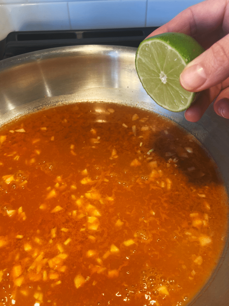 adding lime to Gochujang peanut sauce