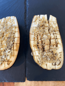 vegan garlic butter and Italian breadcrumbs spread on eggplant