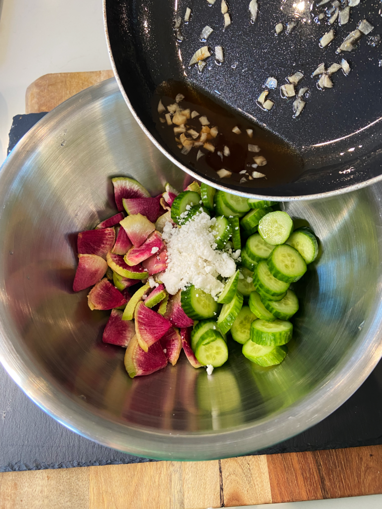 Adding rosemary dressing to air fryer watermelon radish cucumber salad