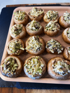 vegan crab stuffed mushrooms on an air fryer tray