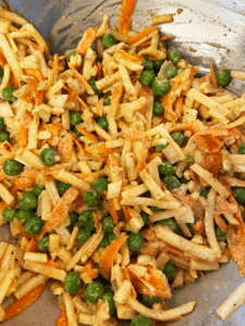 Mixing ingredients for Indian potato mix