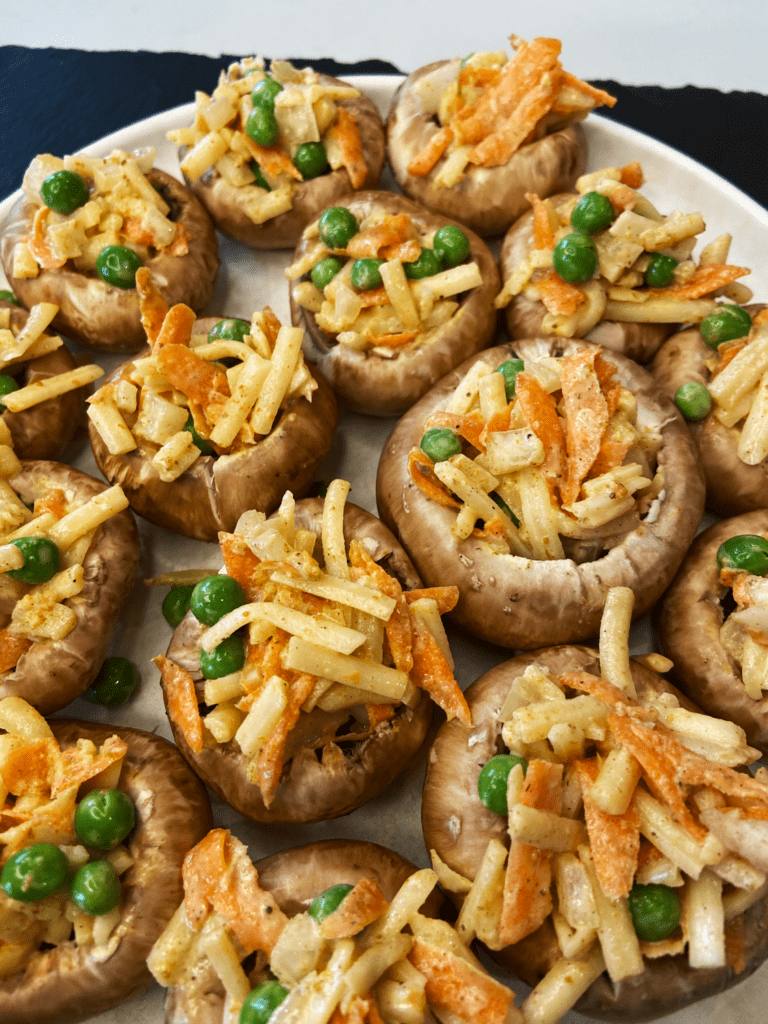 stuffing mushrooms with Indian potato mix