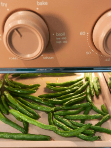 green beans cooking in the air fryer