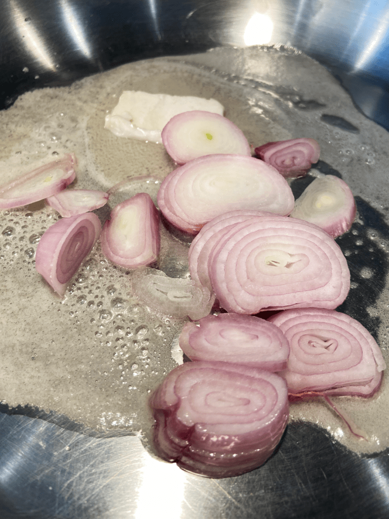 Adding shallots to pan for vegan guinness beyond steak tips