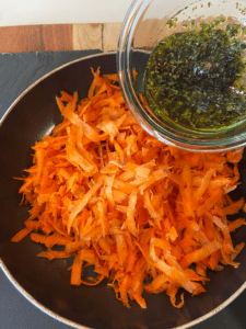 combining marinade with shredded carrots for carrot lox vegan dip